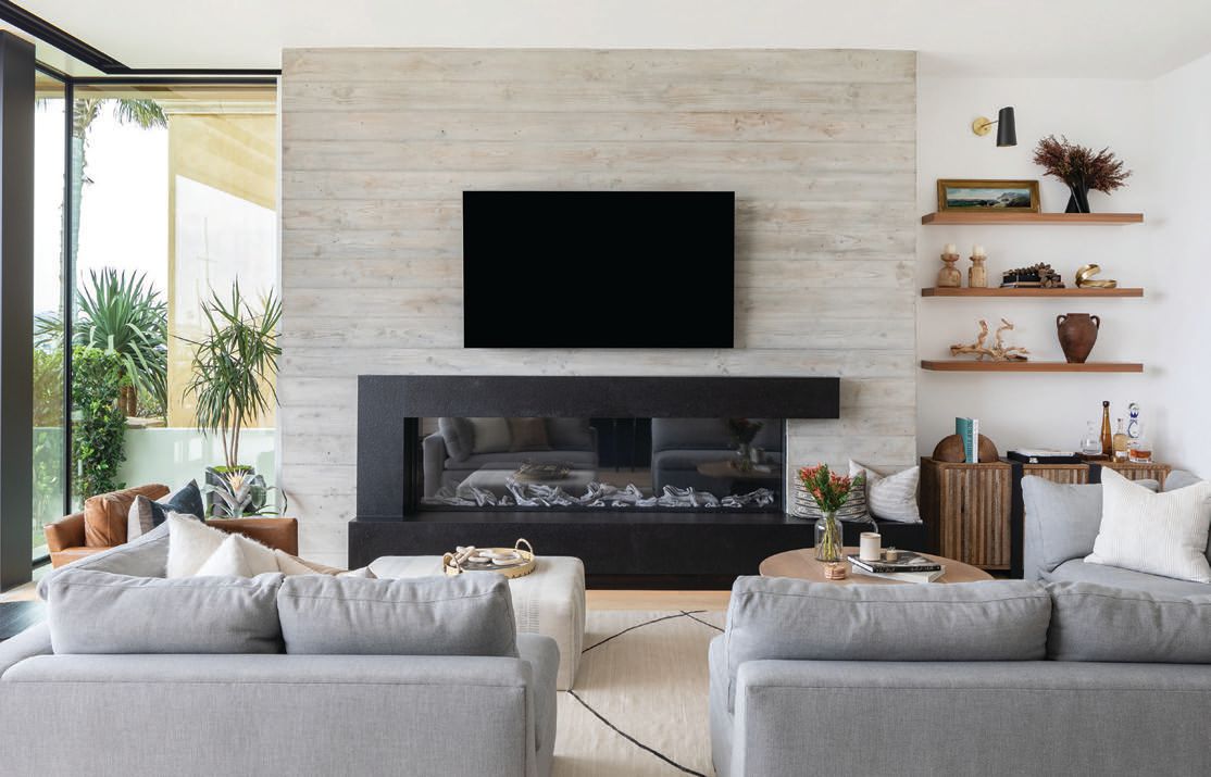 A contemporary fireplace serves as the focal point of the living room. PHOTOGRAPHED BY RYAN GARVIN