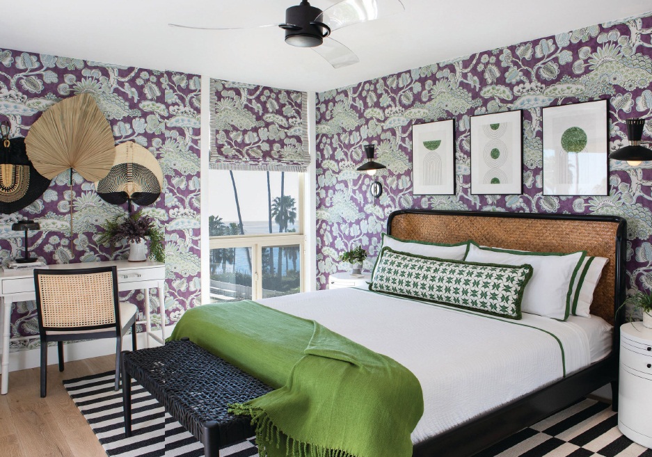 Bold and playful, Anna French for Thibaut Tree House wallpaper in eggplant covers the walls of the primary bedroom. PHOTOGRAPHED BY ERIKA BIERMAN PHOTOGRAPHY