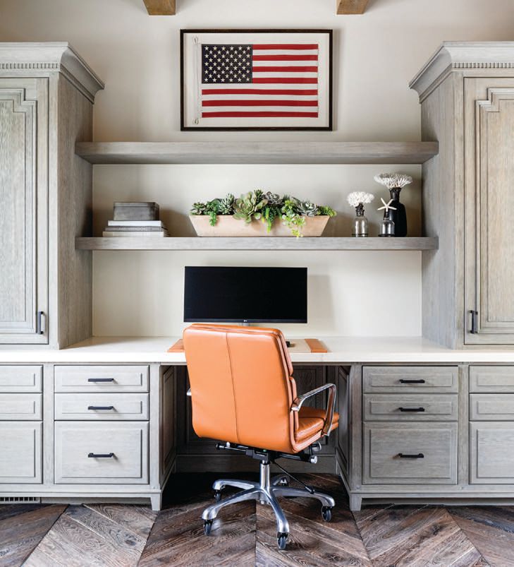 Flags hang above the dual office workstations. PHOTOGRAPHED BY MOLLY ROSE PHOTO