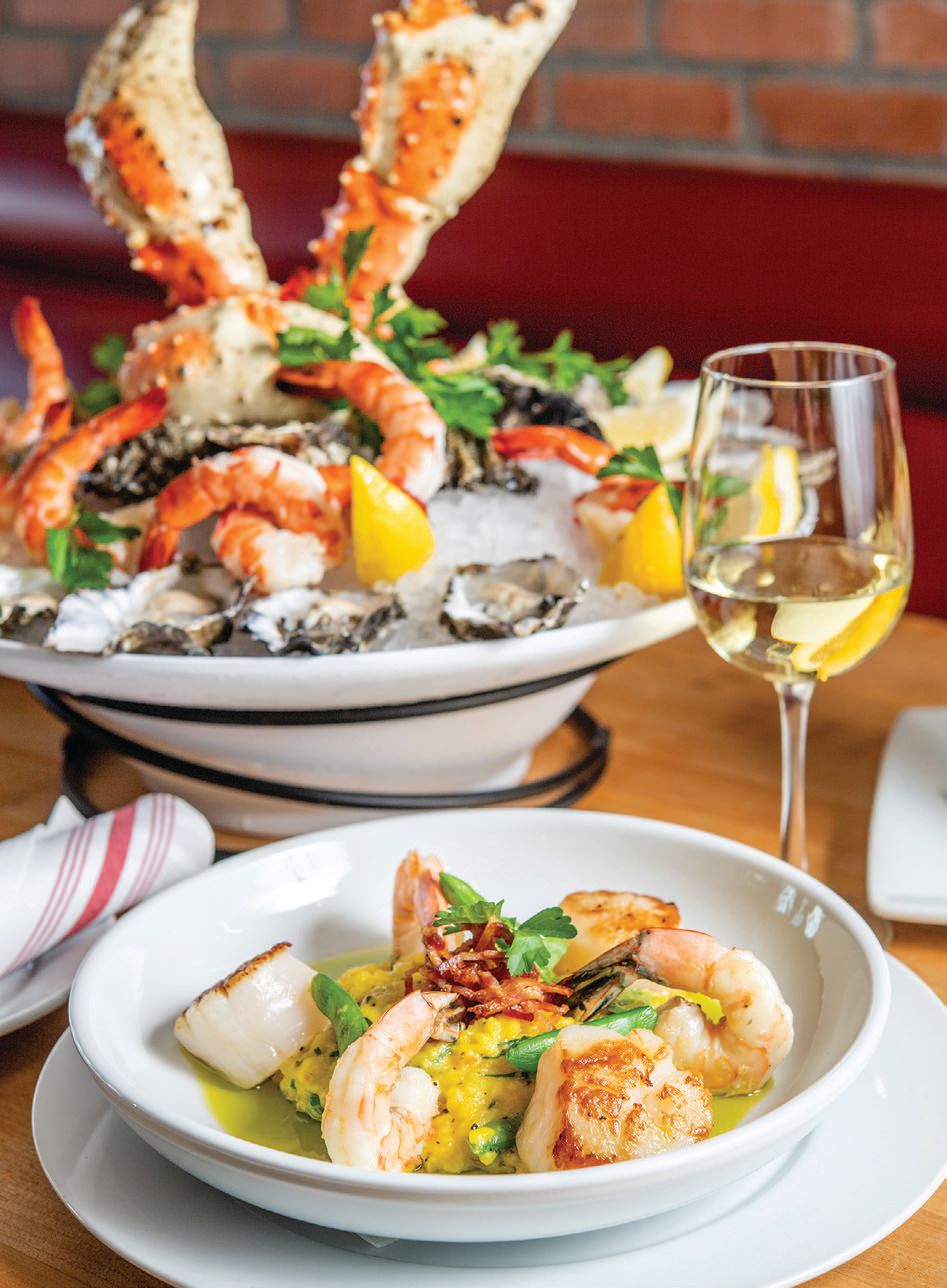 Fly-NFish Oyster Bar & Grill serves ocean-to-fork dishes like a cold seafood platter for two, or shrimp and scallop scampi CRABCAKE PHOTO COURTESY OF BLUEWATER GRILL