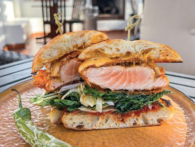 The Rooftop Kitchen   Bar’s tempura salmon sandwich and pan-seared salmon FOOD PHOTO BY ARCHIE HAMI