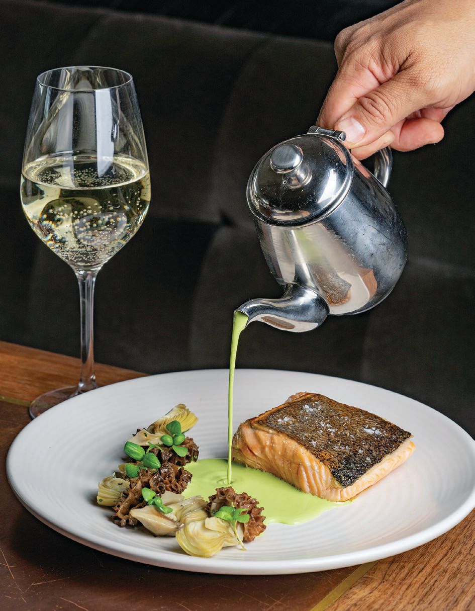 The Bungalow Kitchen’s king salmon arrives with roasted artichokes, morel mushrooms and green garlic PHOTO: COURTESY OF THE BUNGALOW KITCHEN
