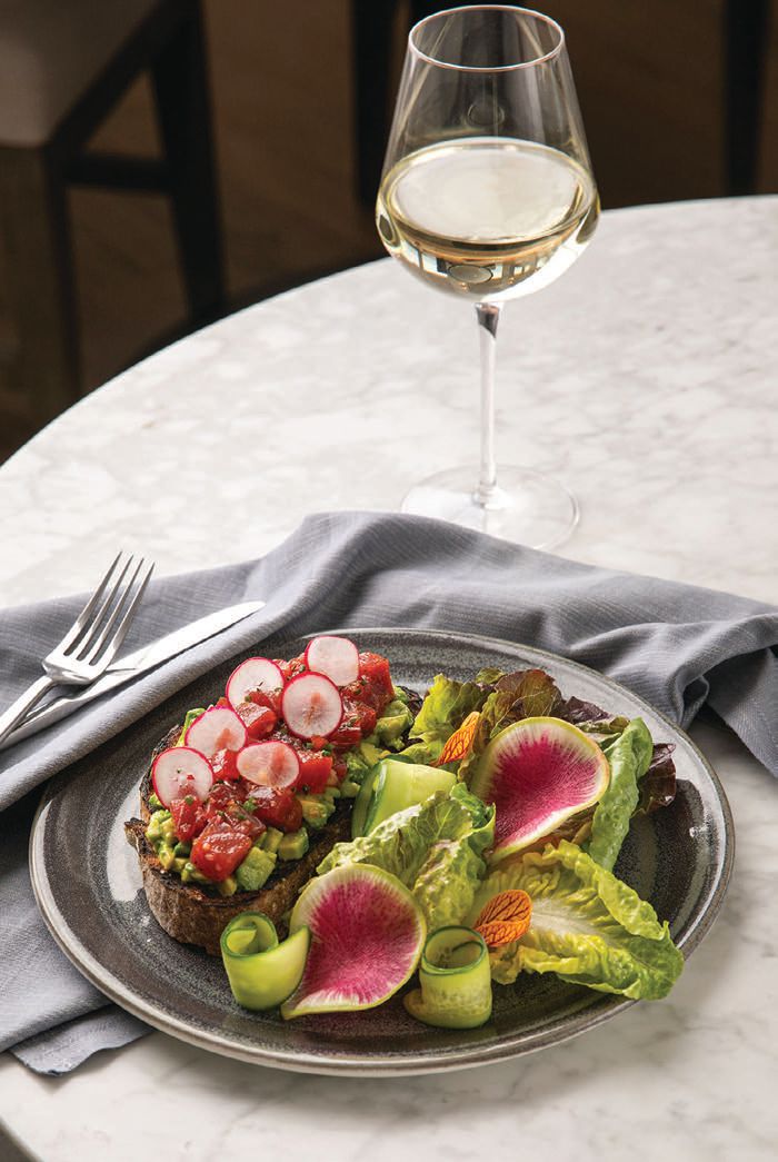 Found on its lunch menu, Larsen’s open-faced tuna tartine includes paprika-dressed sushi-grade tuna on avocado toast with a side green salad. PHOTO COURTESY OF HOTEL LAGUNA