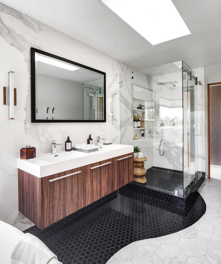 Dramatic wall tiles and a floating vanity add flair to this masculine yet sophisticated bathroom  PHOTO BY CHAD MELLON