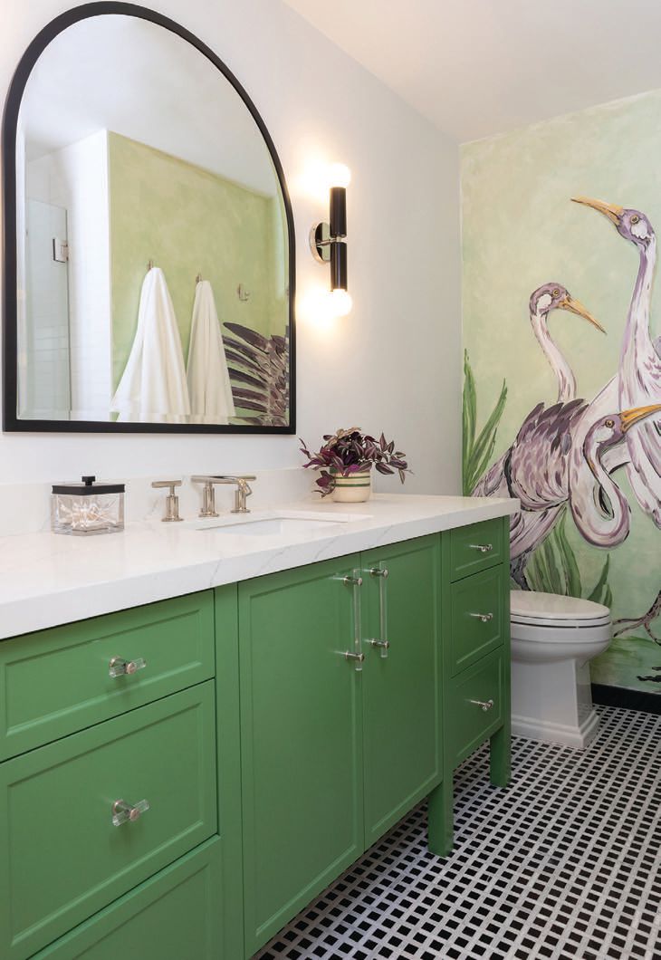 Southern California artist Tina Crandall painted the mural in the verdant primary bathroom PHOTOGRAPHED BY ERIKA BIERMAN PHOTOGRAPHY