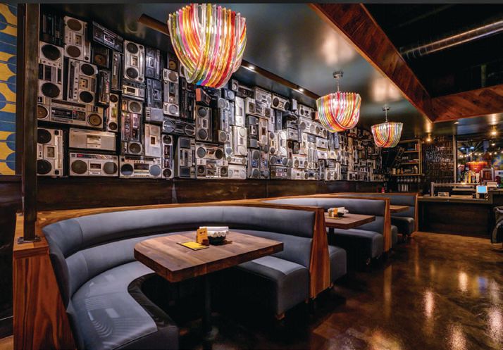 Postino Wine Cafe’s dining room features retro boomboxes along its back wall. PHOTO BY: JOSH CORBIN