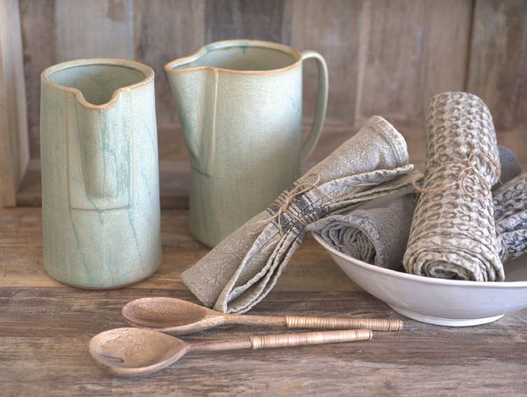 Haven Laguna carries unique tabletop and entertaining pieces, like washed green stoneware pitchers, vintage washed dish towels and wooden salad servers. PHOTO: BY MARA SAMUELS