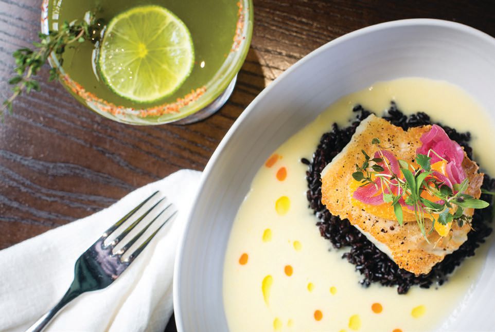 AVEO Table   Bar’s Chilean sea bass is served with black rice, coconut sauce, pickled red onion and orange segments PHOTO: COURTESY OF WALDORF ASTORIA MONARCH BEACH RESORT & CLUB