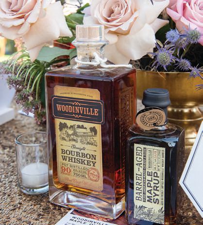 Complimentary whiskey and syrup bottles adorned the VIP tables. PHOTO BY DOUG GIFFORD