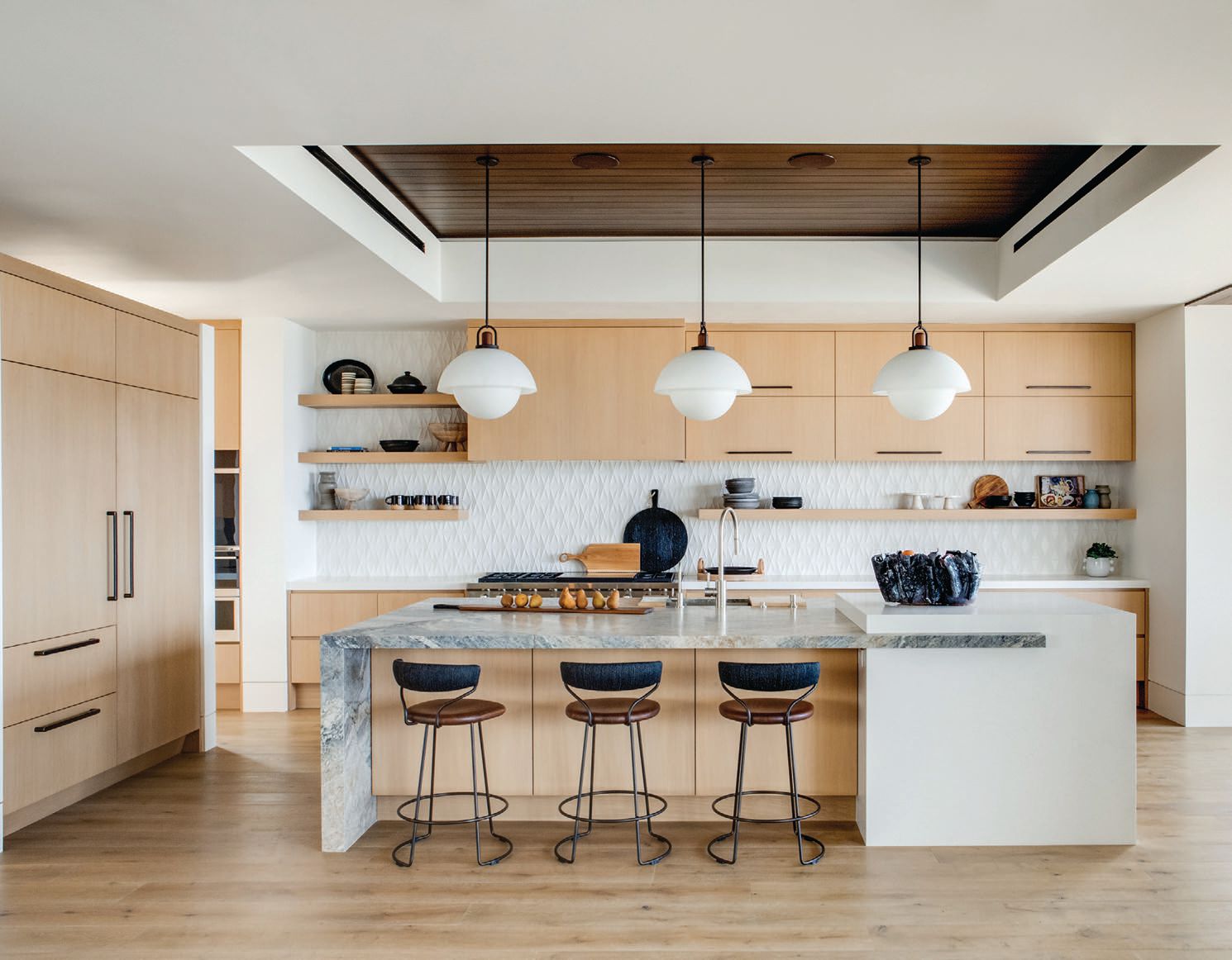Designed by O.C.’s Morrison Design, this sleek kitchen’s backsplash features MADE by Ann Sacks’ Modern Criss Cross tiling in White Shimmer Matte PHOTO: BY MELLON STUDIO